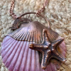 handmade electroformed starfish onto a sea shell pendant necklace
